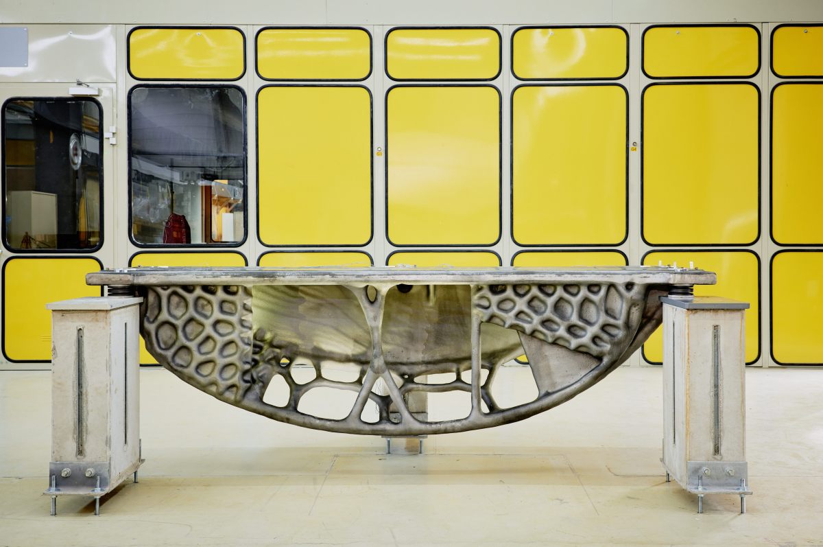 Metal base frame in front of yellow wall
